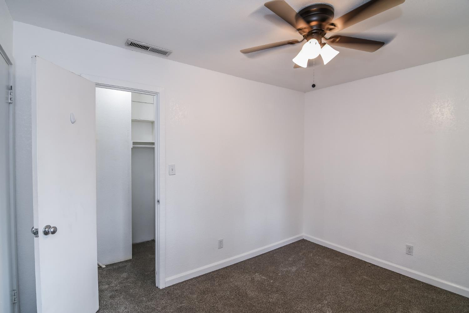 1139 Rivara Circle Sacramento, CA 95864 - Photo 30 of 72 an empty room with a fan and a fan