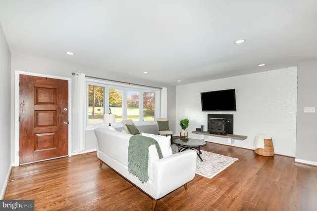 a view of a balcony with wooden floor and fence