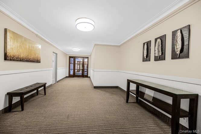 235 Garth Road, Unit E5I Scarsdale, NY 10583 - Photo 15 of 22 a view of workspace with furniture and window