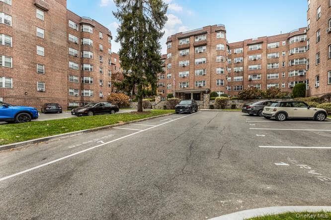 235 Garth Road, Unit E5I Scarsdale, NY 10583 - Photo 18 of 22 a view of street with parked cars
