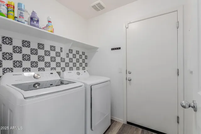 a utility room with dryer and washer