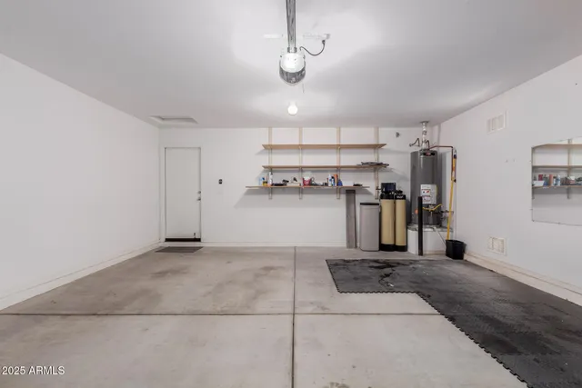 a view of a kitchen with a sink stainless steel appliances and cabinets