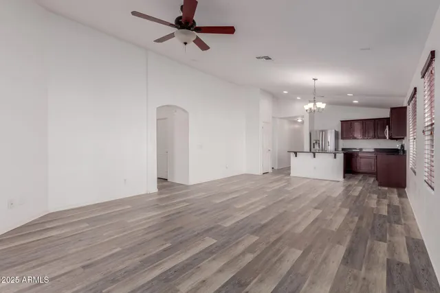 a view of a kitchen with a dishwasher and a stove top oven