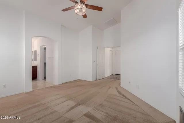 a bathroom with a tub a sink and mirrors