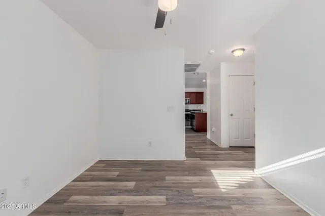 a view of a room with cabinet and mirrors