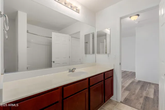 a bathroom with a sink and a mirror