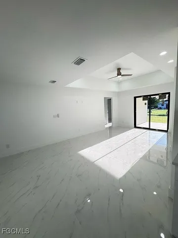a view of a kitchen with a sink and cabinets