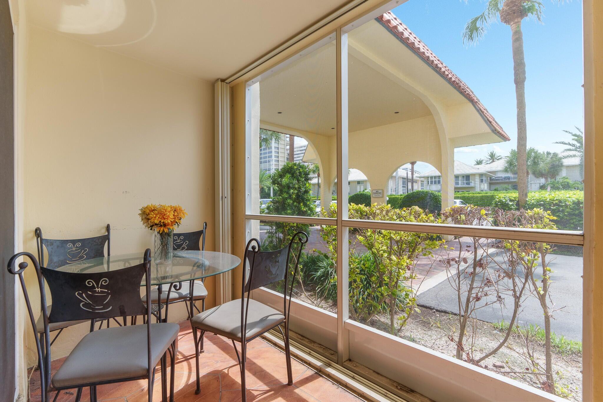 951 De Soto Road, Unit 130 Boca Raton, FL 33432 - Photo 22 of 38 a view of a chairs and table in the balcony