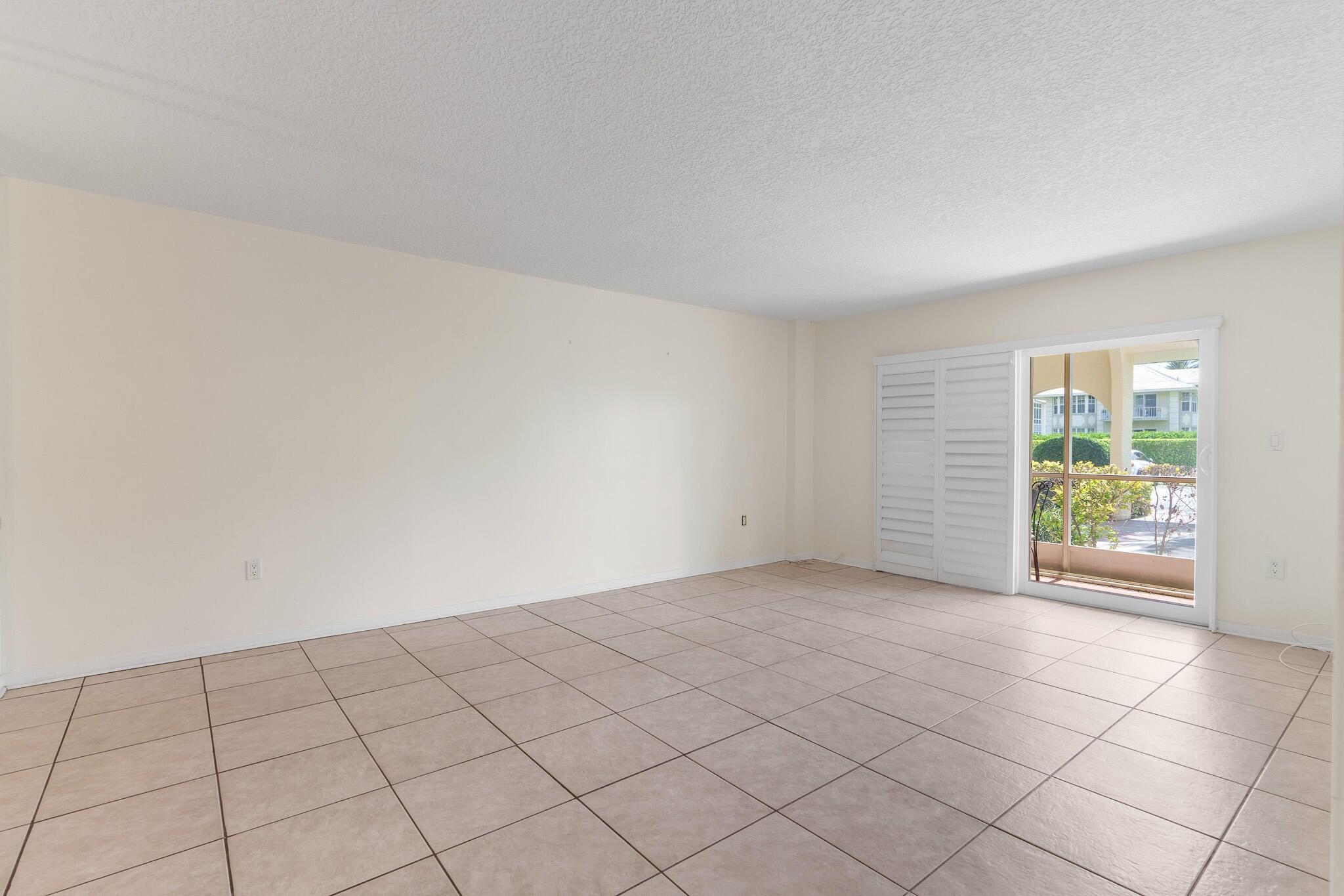 951 De Soto Road, Unit 130 Boca Raton, FL 33432 - Photo 6 of 38 an empty room with windows