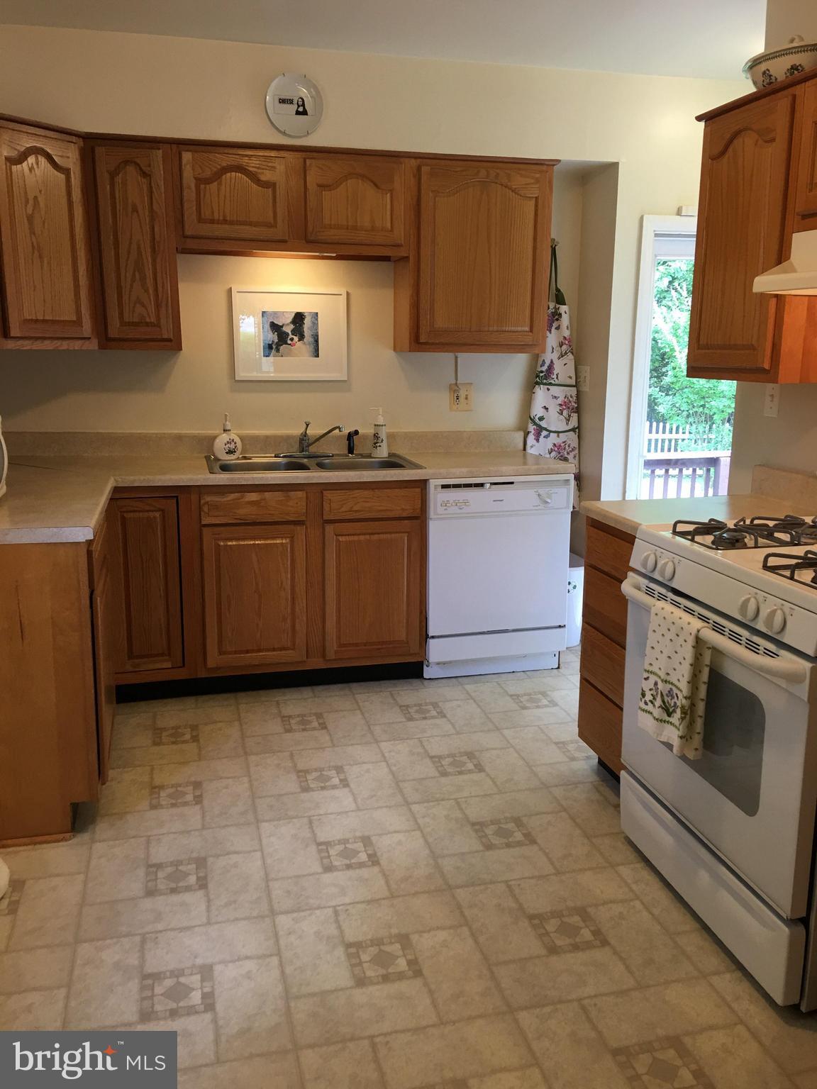 28 South Ritters Lane Owings Mills, MD 21117 - Photo 24 of 30 a kitchen with stainless steel appliances granite countertop a stove a sink and a microwave