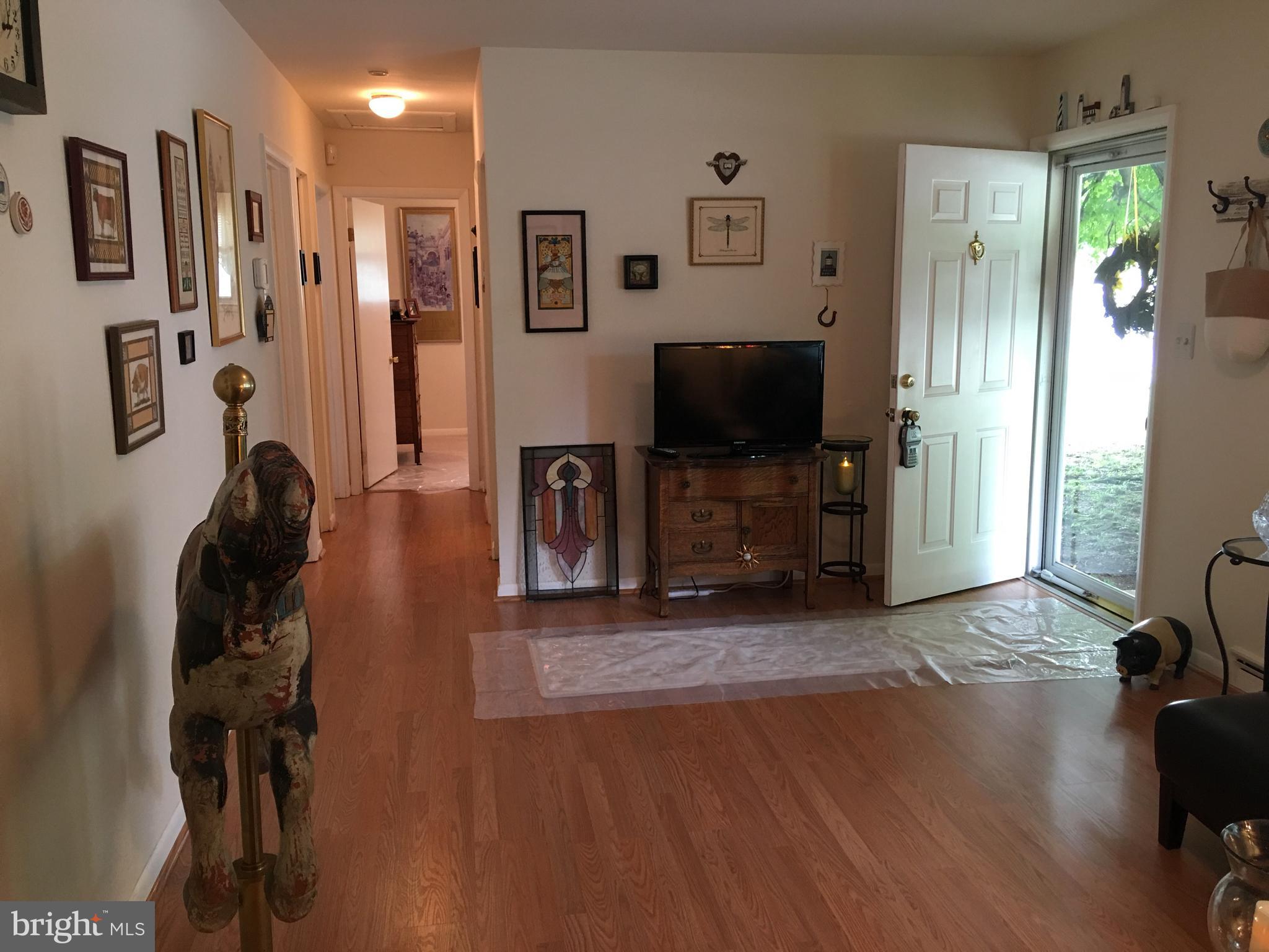 28 South Ritters Lane Owings Mills, MD 21117 - Photo 25 of 30 a living room with furniture and a flat screen tv