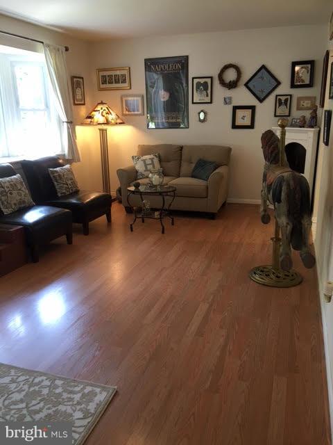 28 South Ritters Lane Owings Mills, MD 21117 - Photo 5 of 30 a living room with furniture and a fireplace