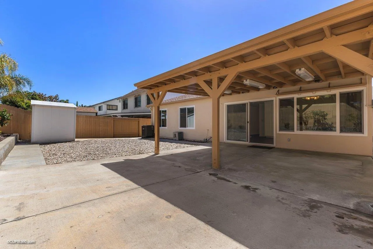 11129 Sagittarius Road San Diego, CA 92126 - Photo 5 of 8 front view of a house with a street