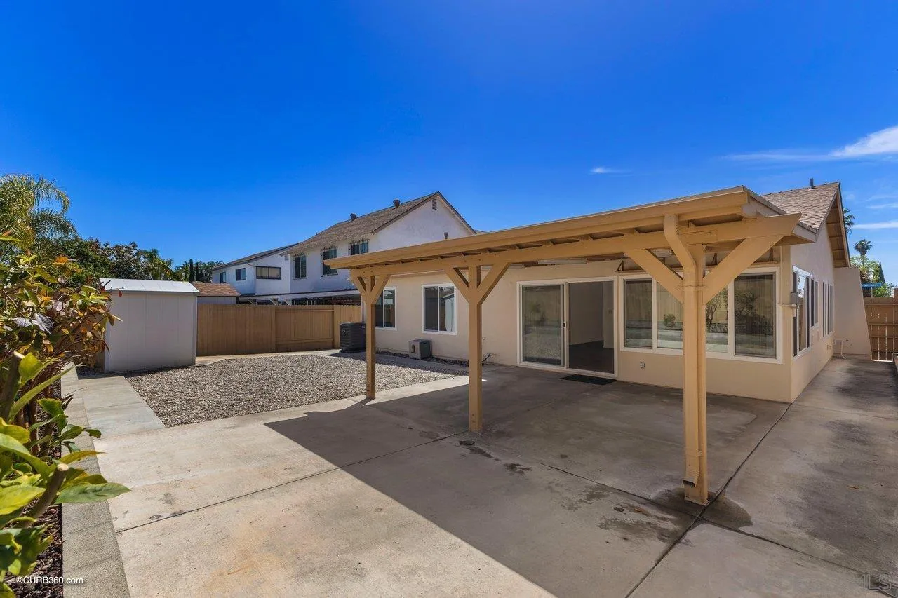 11129 Sagittarius Road San Diego, CA 92126 - Photo 6 of 8 a view of a house with a patio