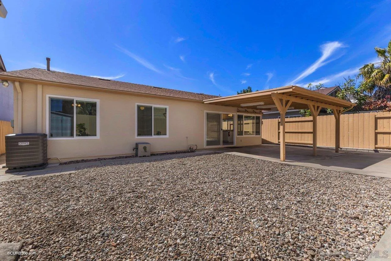 11129 Sagittarius Road San Diego, CA 92126 - Photo 8 of 8 a front view of a house with a yard