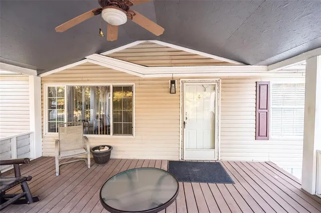 a view of a bedroom with a bed and a window