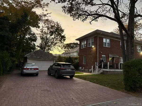 a view of a car parked in front of a house