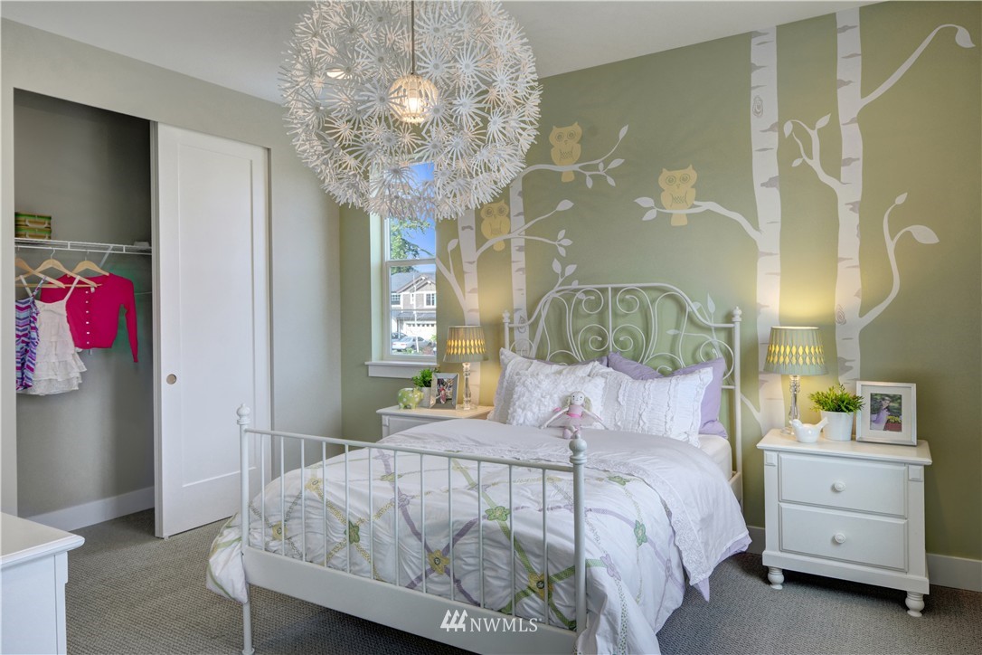 258 Field Place Southeast Renton, WA 98059 - Photo 16 of 19 a bedroom with a bed and a chandelier