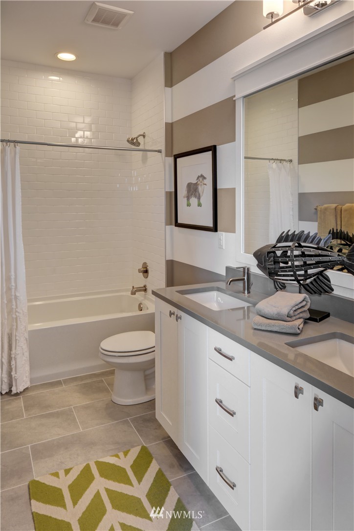 258 Field Place Southeast Renton, WA 98059 - Photo 19 of 19 a bathroom with a granite countertop sink a toilet and shower