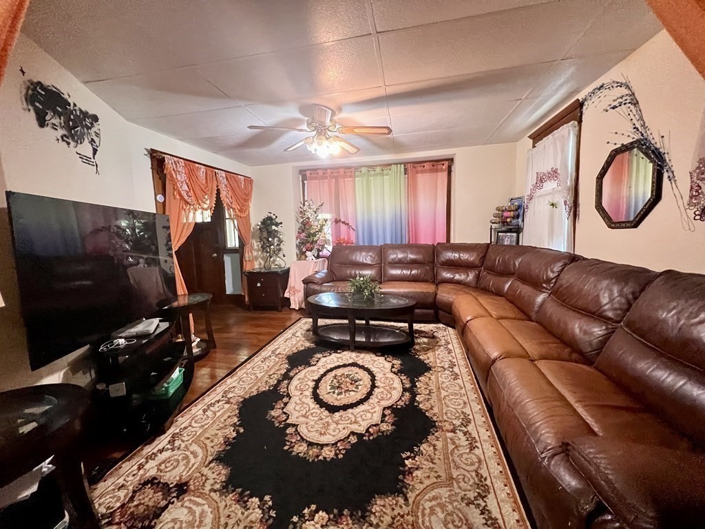 23 Webster Avenue West Springfield, MA 01089 - Photo 3 of 13 a living room with furniture and a flat screen tv