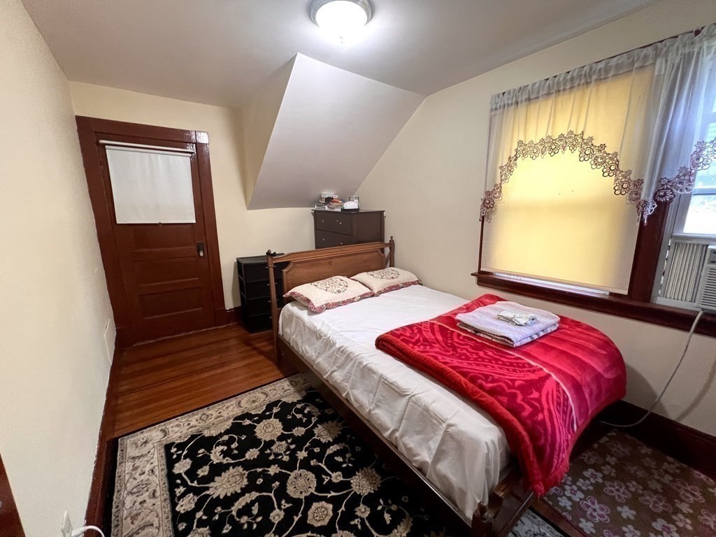 23 Webster Avenue West Springfield, MA 01089 - Photo 7 of 13 a bedroom with a bed and a window