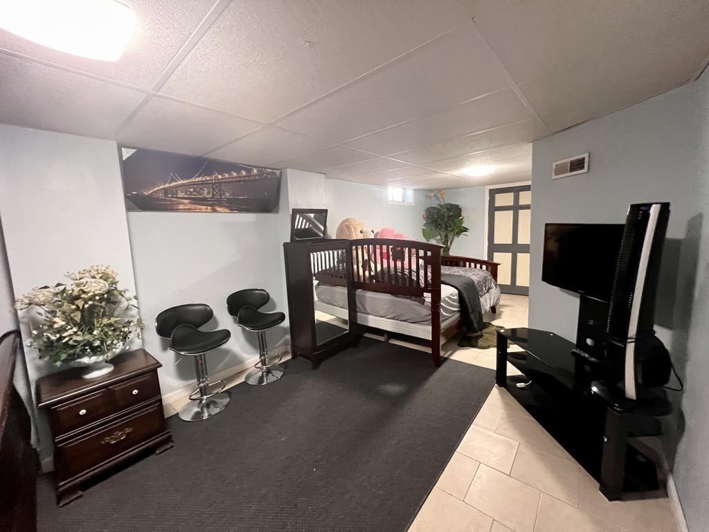 23 Webster Avenue West Springfield, MA 01089 - Photo 9 of 13 a living room with furniture and a flat screen tv