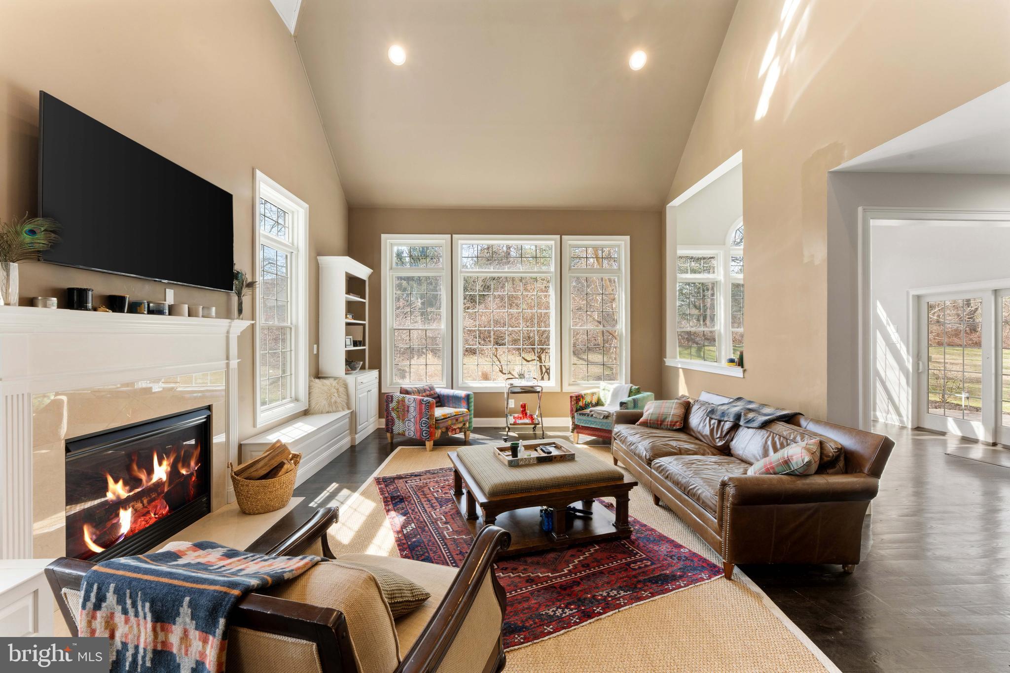 8 Quartermaster Road Feasterville-Trevose, PA 19053 - Photo 16 of 60 a living room with furniture a flat screen tv and a fireplace
