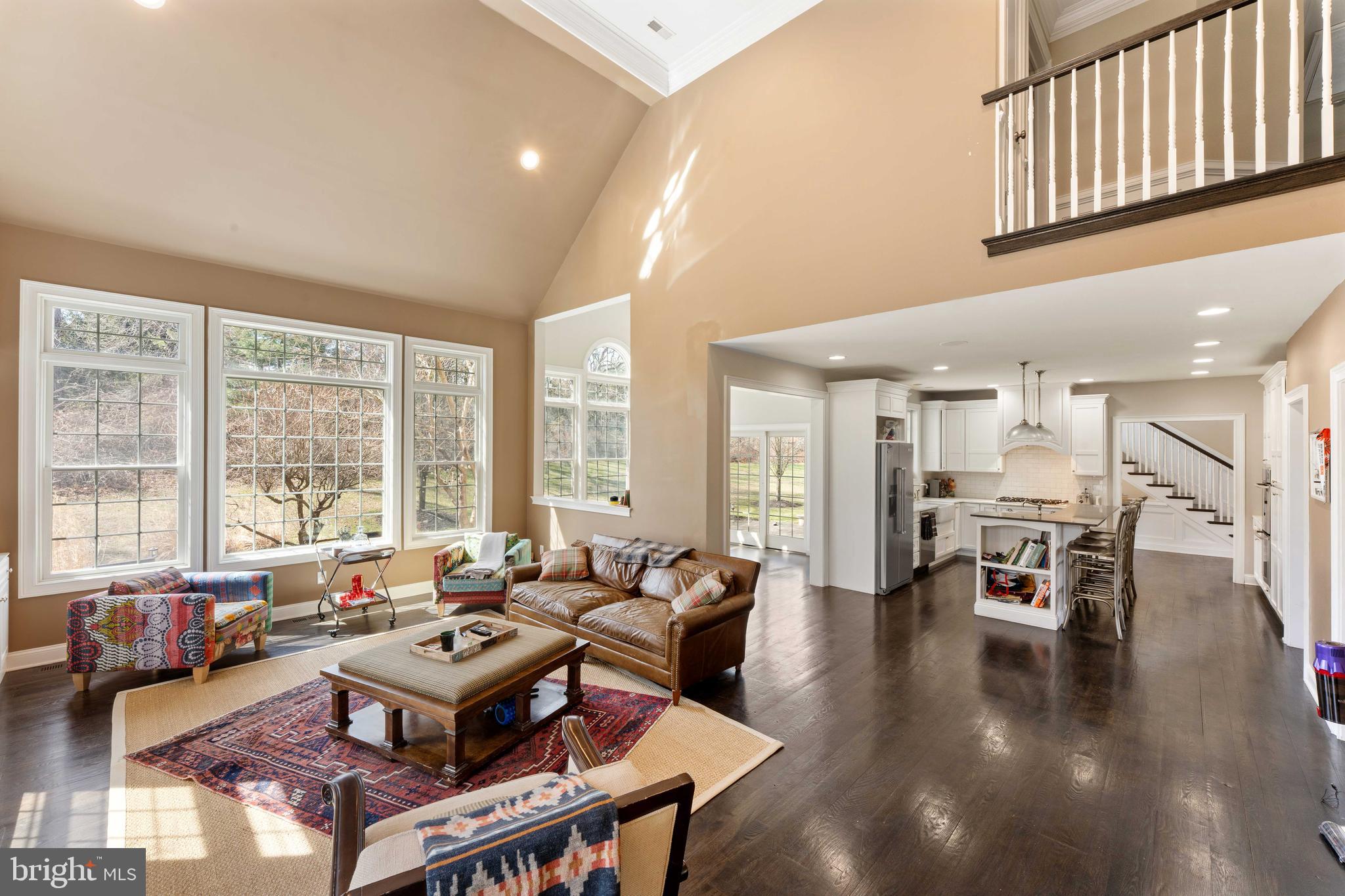 8 Quartermaster Road Feasterville-Trevose, PA 19053 - Photo 19 of 60 a living room with lots of furniture a rug wooden floor and a large window