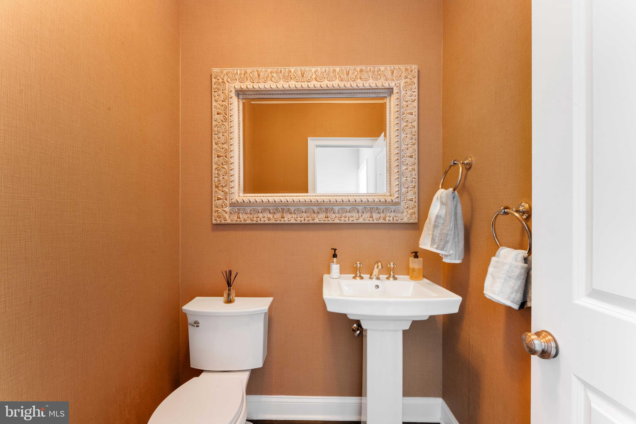 8 Quartermaster Road Feasterville-Trevose, PA 19053 - Photo 22 of 60 a bathroom with a toilet sink and mirror