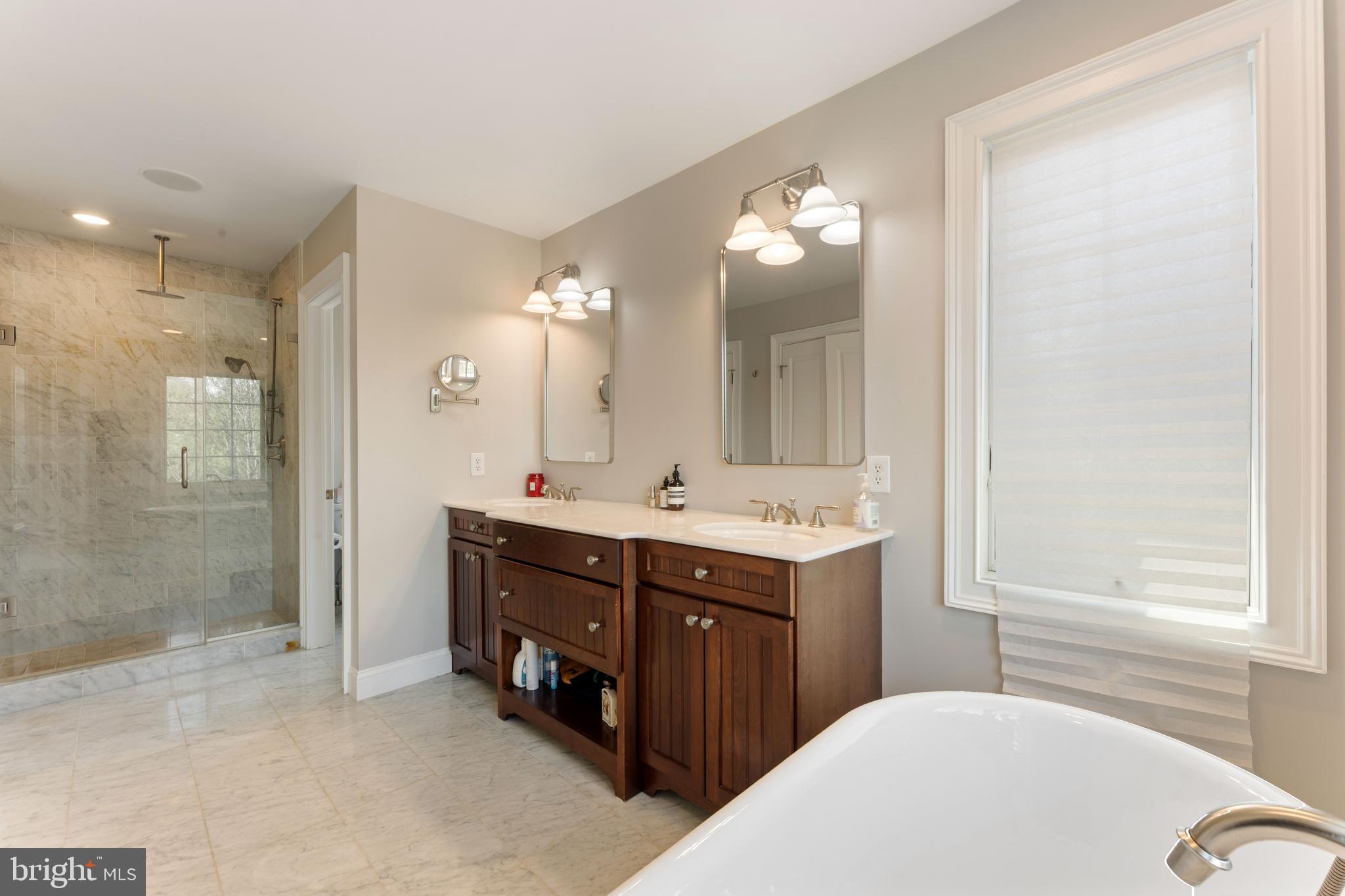 8 Quartermaster Road Feasterville-Trevose, PA 19053 - Photo 32 of 60 a bathroom with a double vanity sink mirror and shower