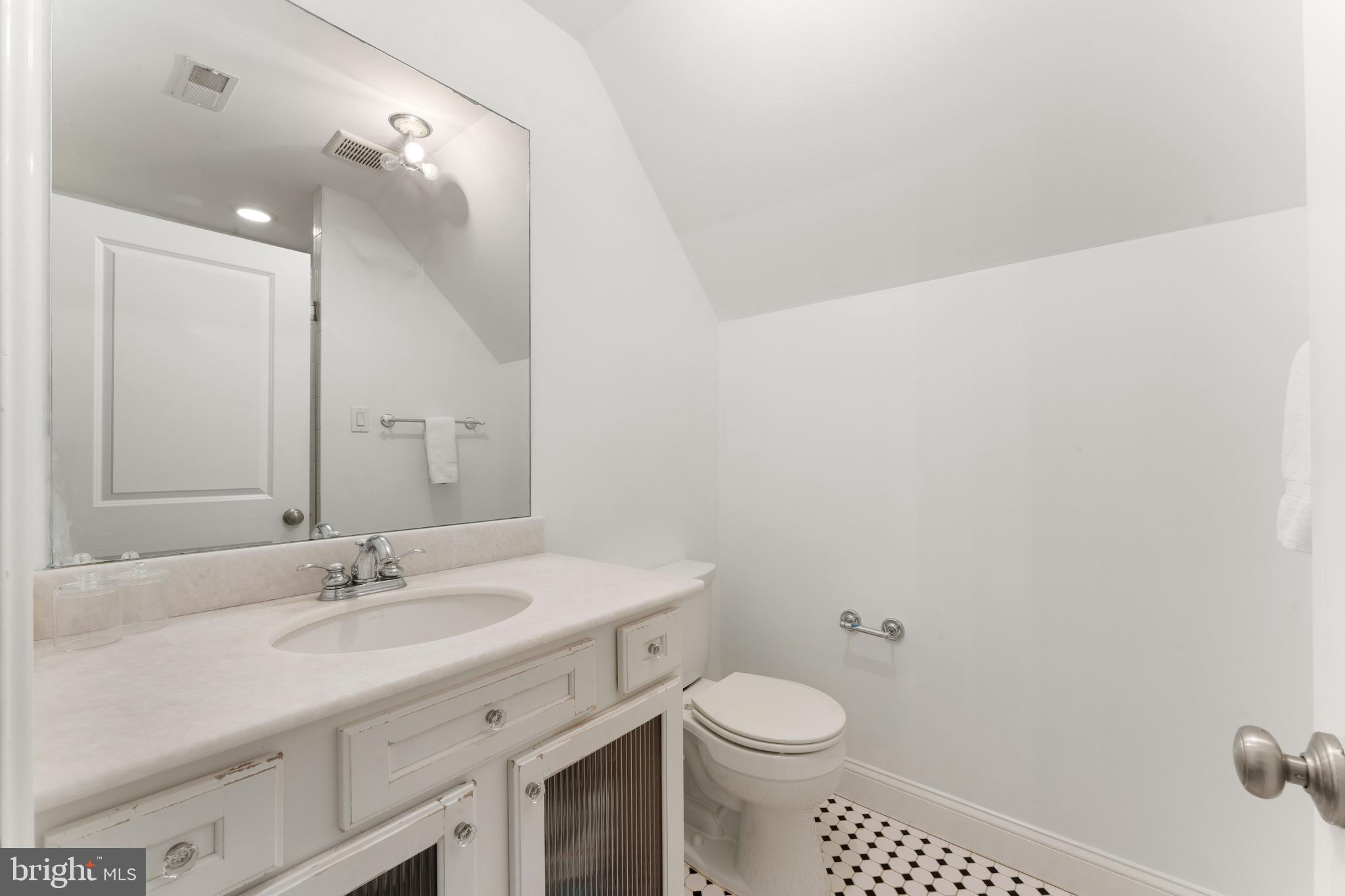 8 Quartermaster Road Feasterville-Trevose, PA 19053 - Photo 37 of 60 a bathroom with a sink a toilet and a mirror