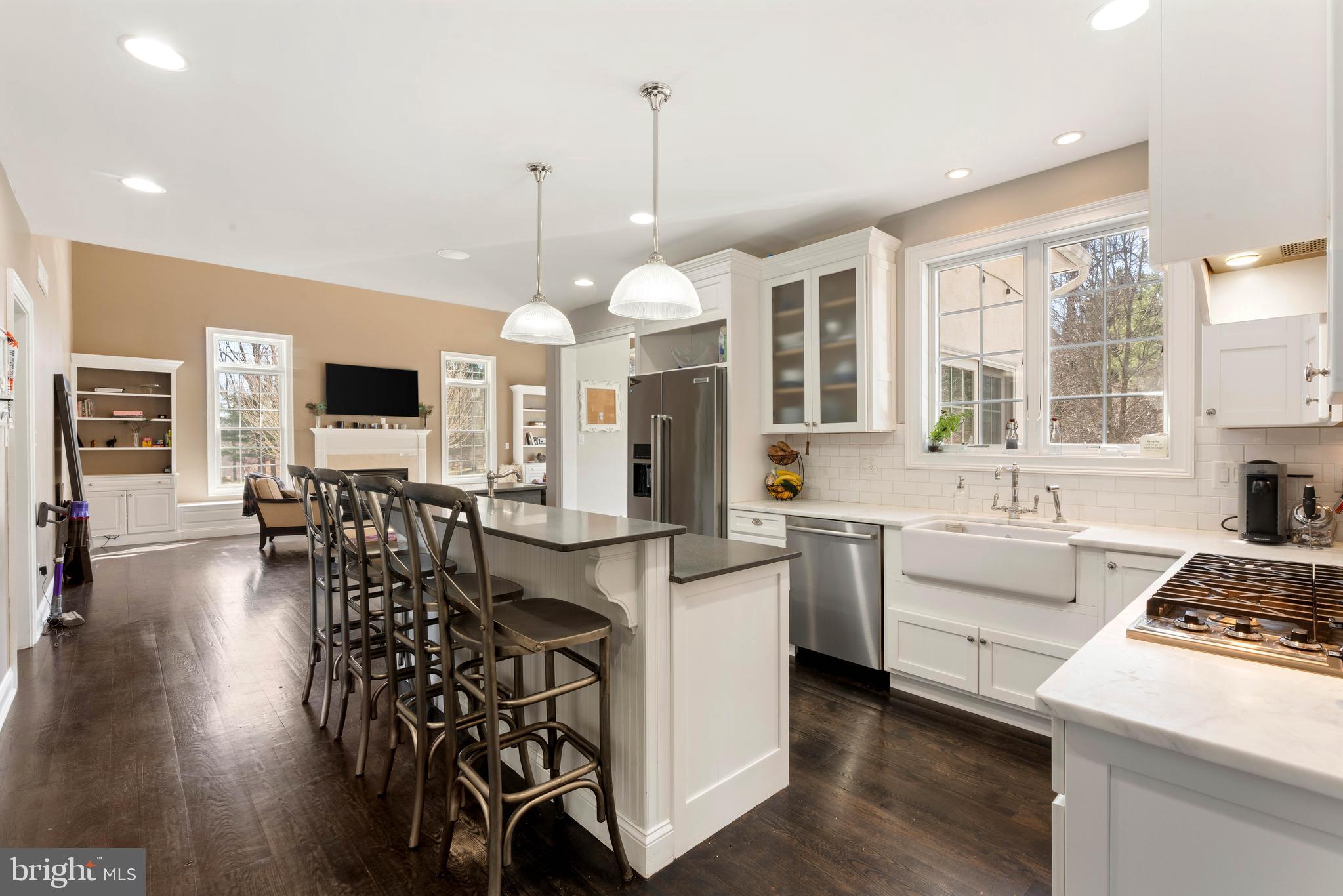 8 Quartermaster Road Feasterville-Trevose, PA 19053 - Photo 10 of 60 a kitchen with stove a sink dishwasher a dining table and chairs with wooden floor
