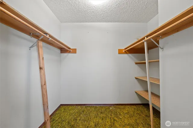 a view of a kitchen with furniture and windows