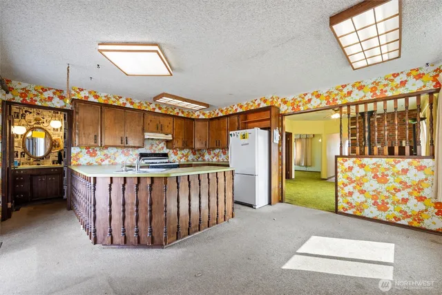 a bedroom with furniture and a flat screen tv