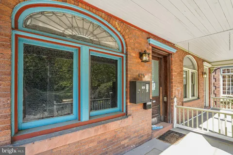 a front view of a house with a large window