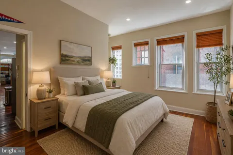 a bedroom with bed and window