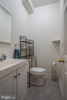a bathroom with a toilet and a sink