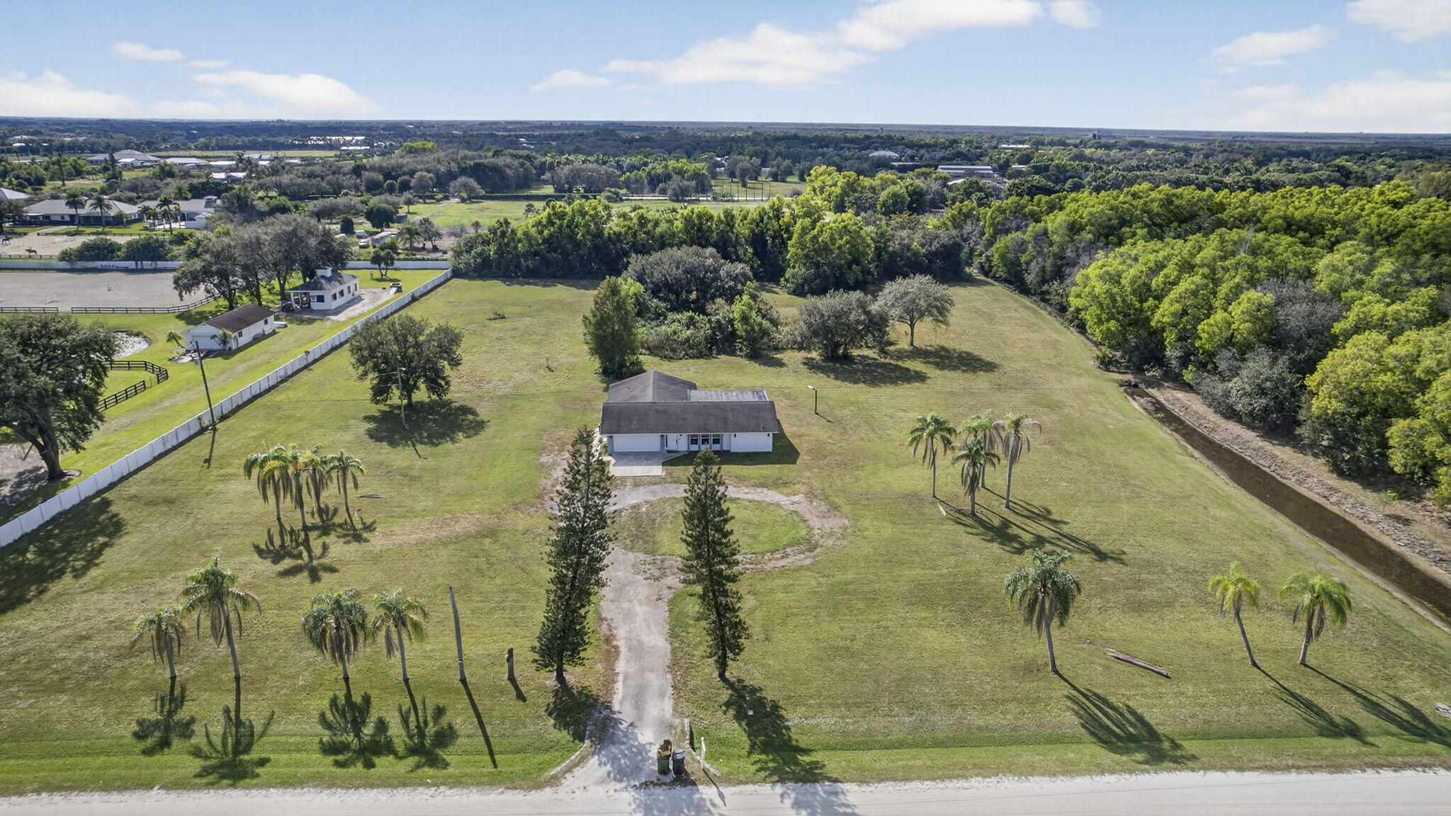 16490 Rustic Road Wellington, FL 33470 - Photo 2 of 82 60-web-or-mls-DJI_0345