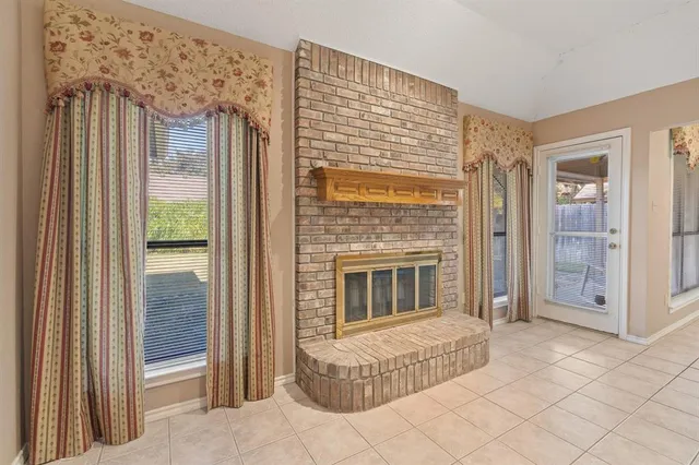 a bedroom with a bed and a fireplace