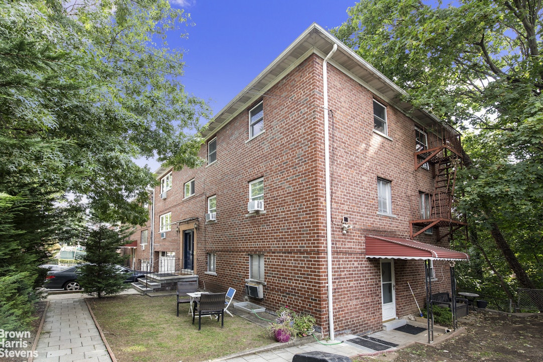 5834 Fieldston Road Bronx, NY 10471 - Photo 13 of 15 a view of a house with sitting area and swimming pool