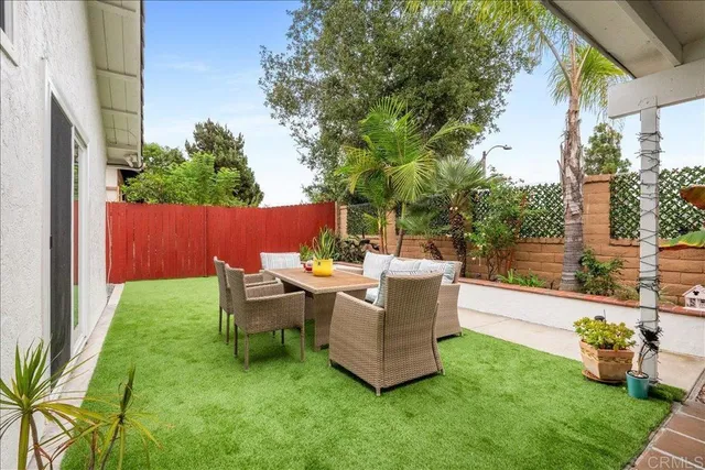 a view of a couches in backyard of house