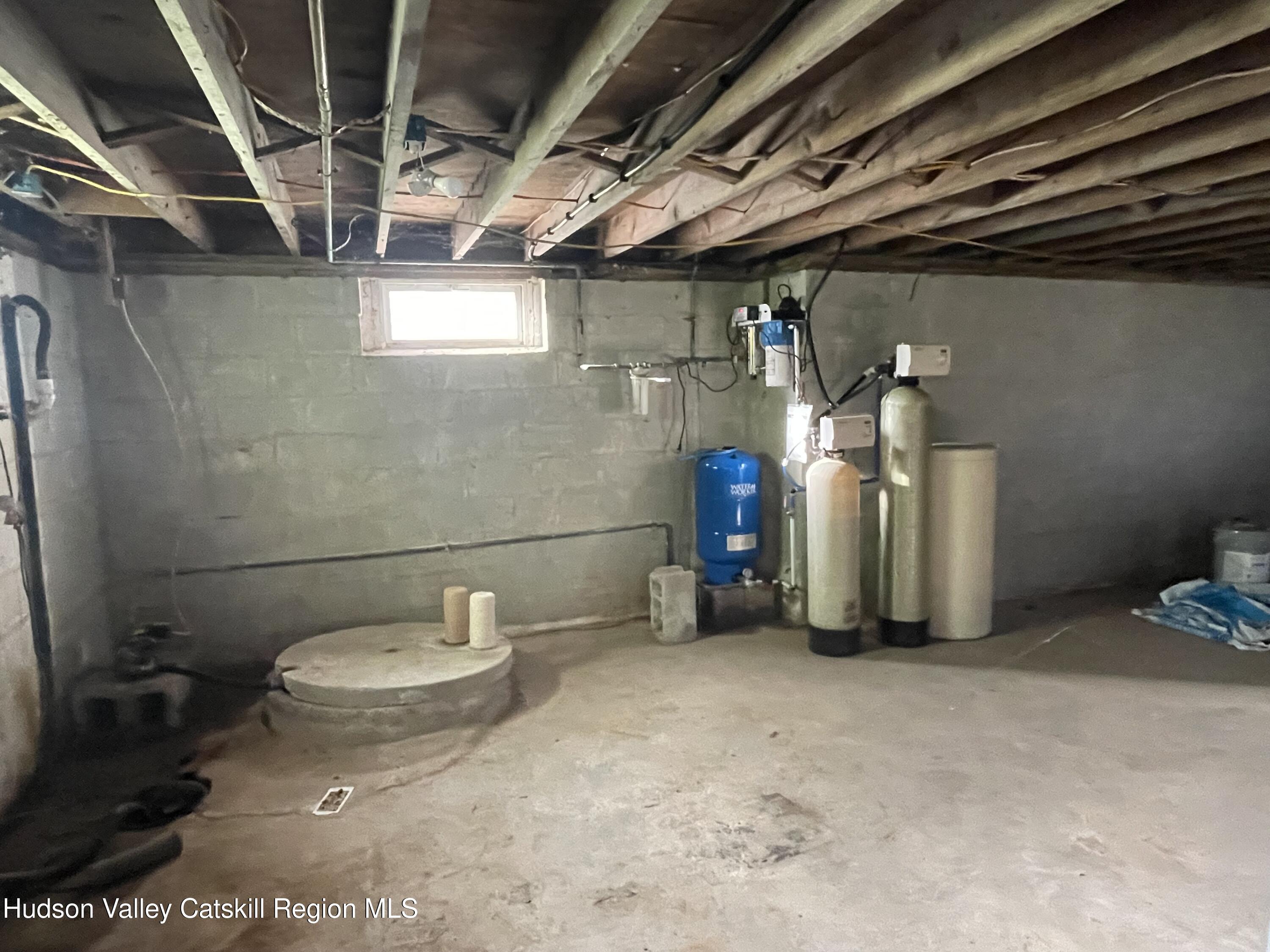 10 Johns Road Kerhonkson, NY 12446 - Photo 22 of 30 a view of a storage room with water heater and racks