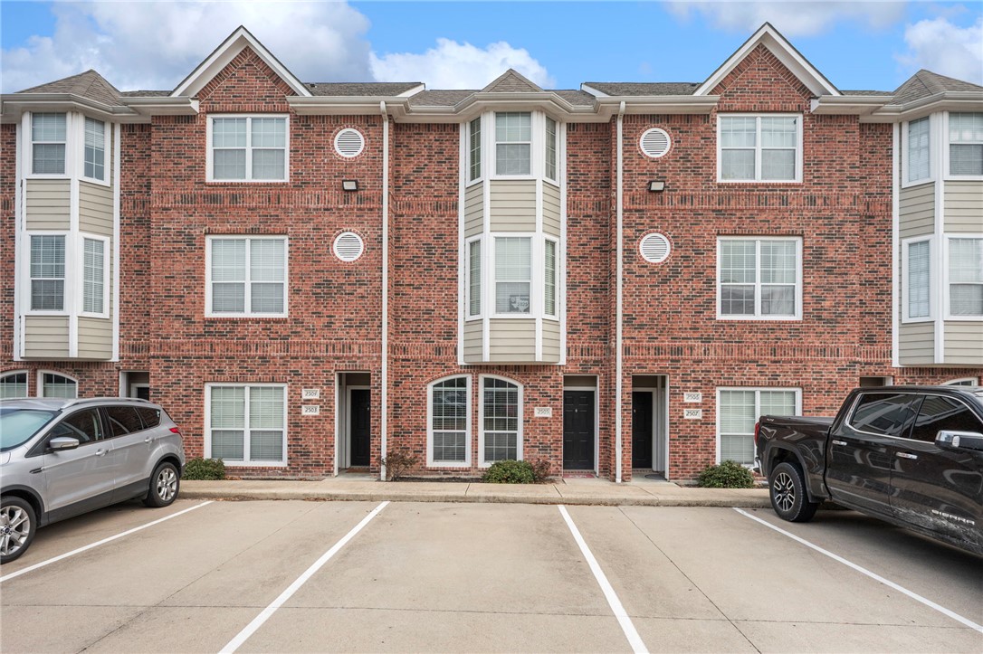 1198 Jones-Butler Road, Unit 2505 College Station, TX 77840 - Photo 1 of 13 a view of a car parked in front of a brick house