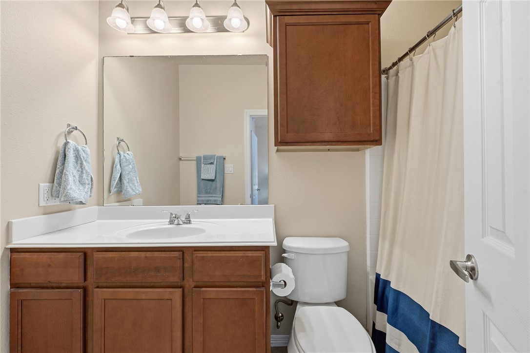 1198 Jones-Butler Road, Unit 2505 College Station, TX 77840 - Photo 10 of 13 a bathroom with a toilet sink and mirror
