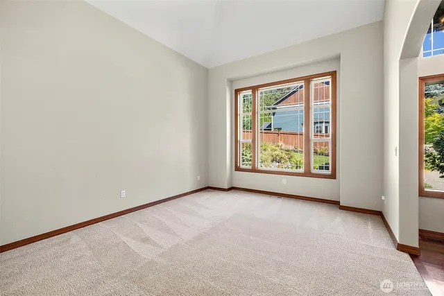 an empty room with windows and view