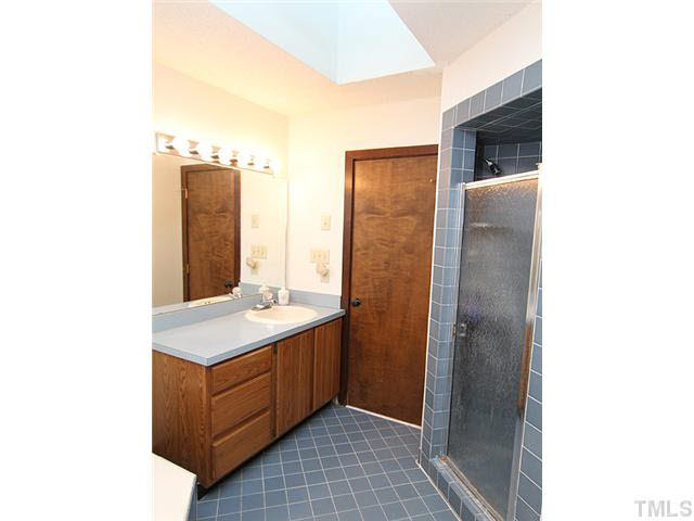 2713 Sherborne Place Raleigh, NC 27612 - Photo 10 of 25 The master bath is in good shape and has a nice layout with walk-in spate shower. Notice the skylight above also! Also newly replaced. You also have a walk-in closet.