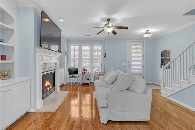 a living room with furniture fireplace and flat screen tv
