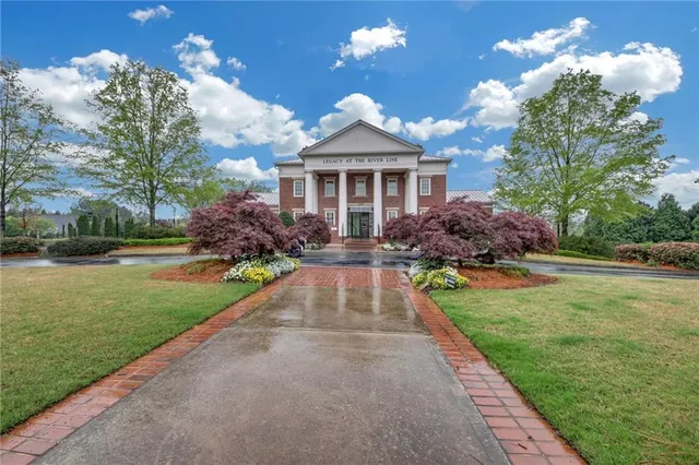 a living room with furniture fireplace and flat screen tv