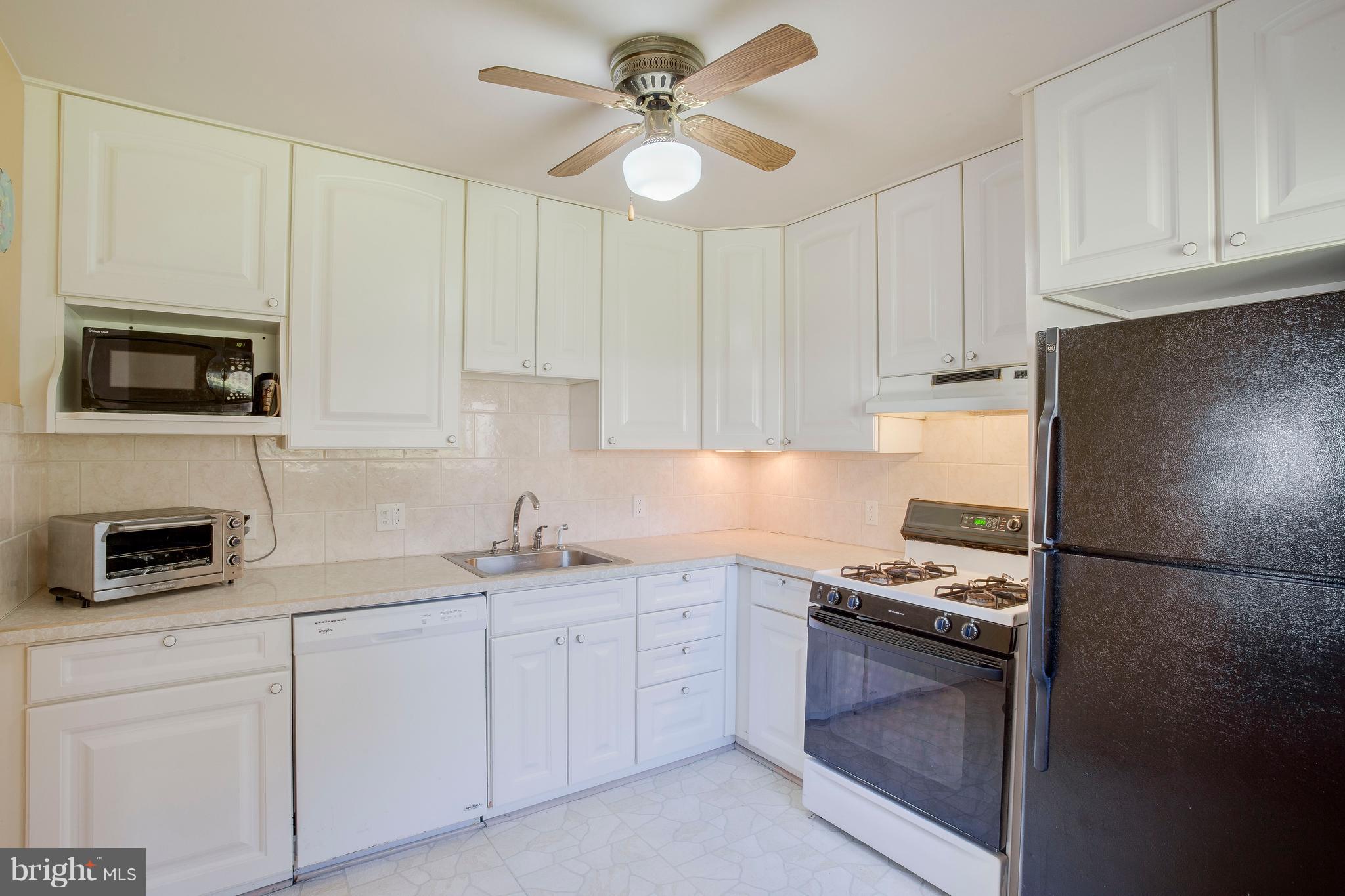 256 Candytuft Road Reisterstown, MD 21136 - Photo 16 of 37 a kitchen with cabinets stainless steel appliances and a counter space