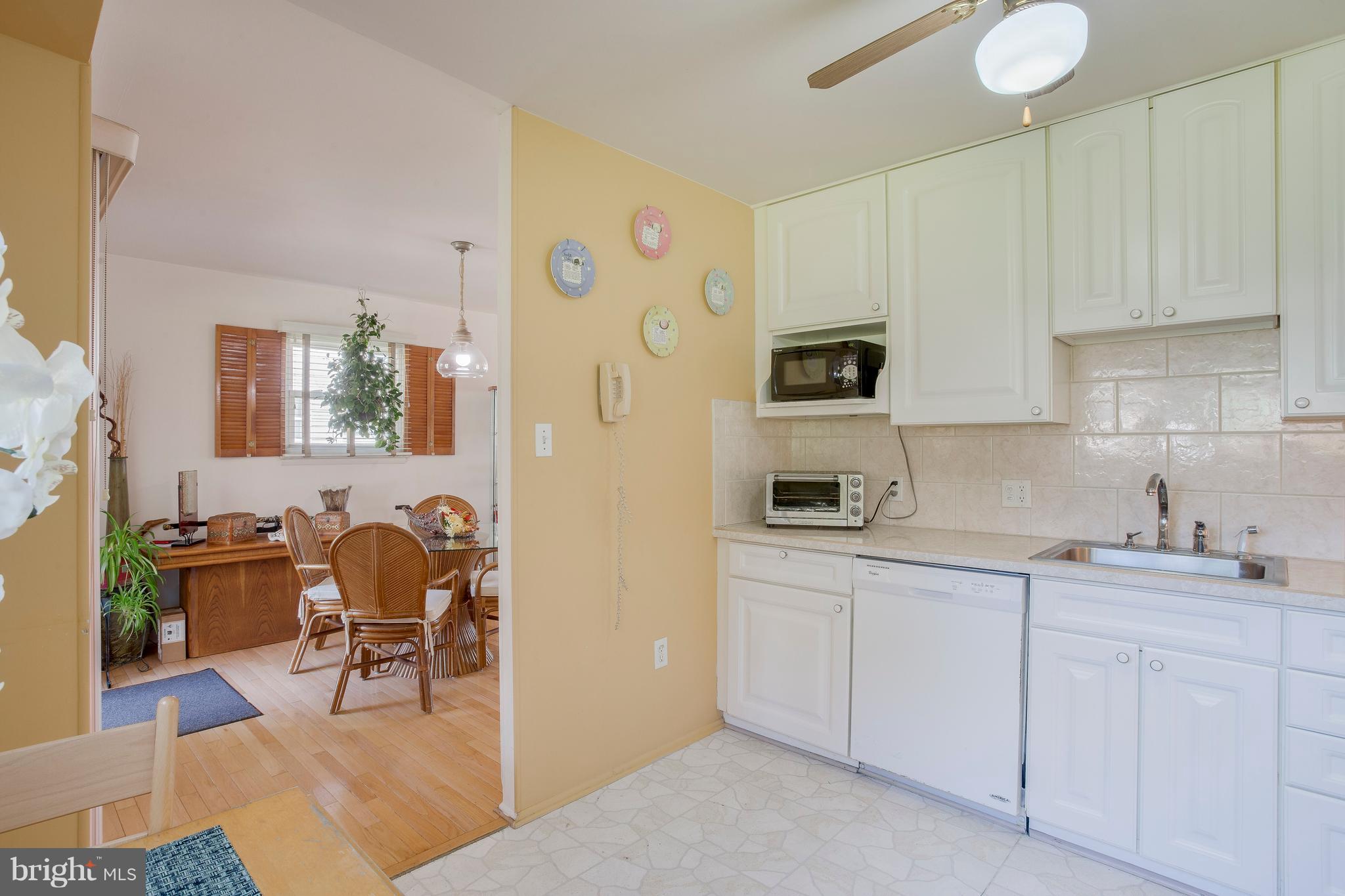 256 Candytuft Road Reisterstown, MD 21136 - Photo 18 of 37 a kitchen with cabinets and chairs in it